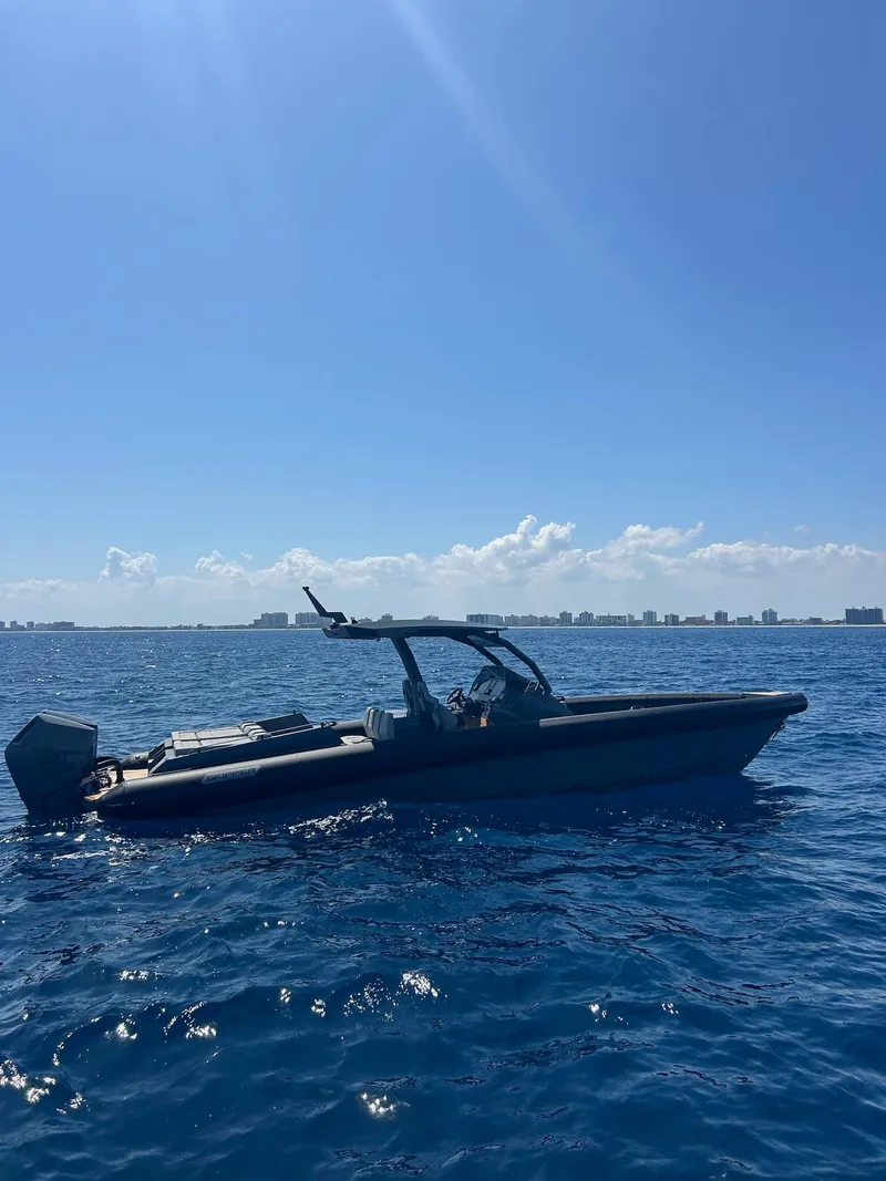 Slide: The Image of Skipper-BSK 38 boat on open sea, 2025 model, under clear blue sky. - 7