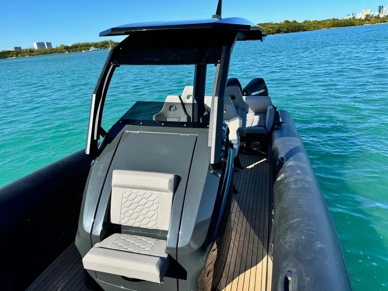 Slide: The Image of 2025 Skipper-BSK 34 boat on water, featuring sleek design and modern seating. - 22