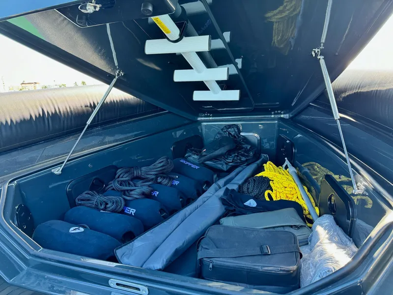 Slide: The Image of Open storage compartment of Skipper-BSK 34 boat, showcasing organized gear and equipment, 2025 model. - 23