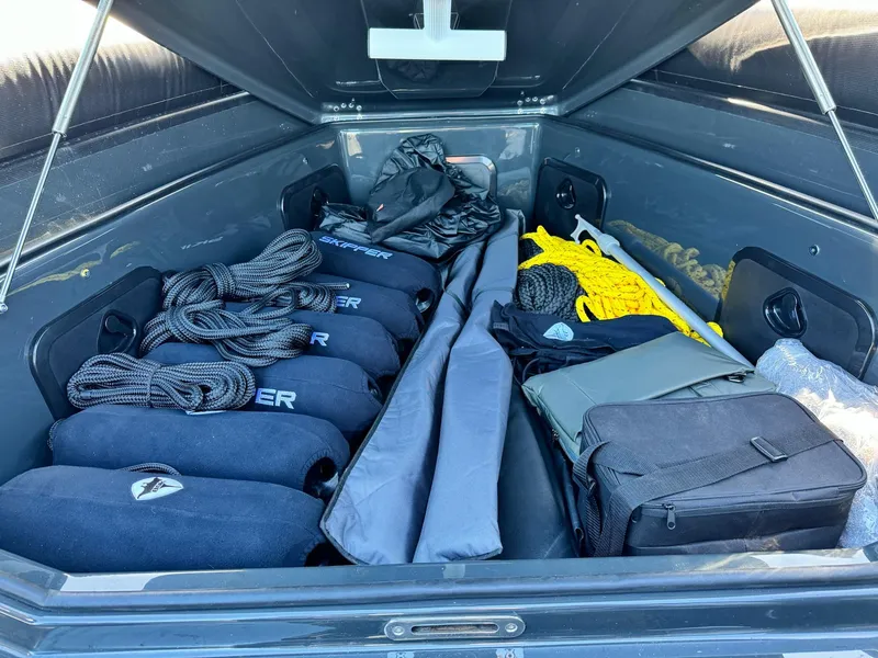 Slide: The Image of Storage compartment of Skipper-BSK 34 boat, 2025 model, with ropes and gear neatly organized. - 24