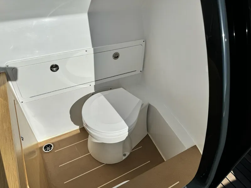 Slide: The Image of Compact marine toilet in Skipper-BSK 34 boat, 2025 model, featuring sleek design and efficient use of space. - 7