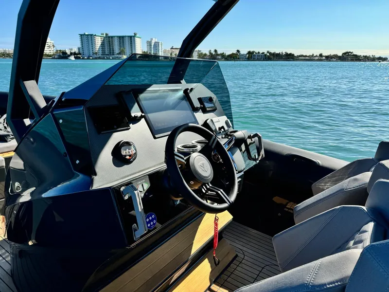 Slide: The Image of Modern Skipper-BSK 34 boat dashboard, 2025 model, with sleek design and waterfront view. - 9