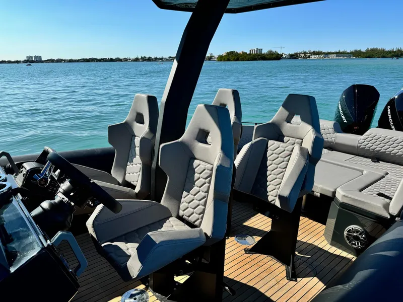 Slide: The Image of Luxury Skipper-BSK 34 boat interior, 2025 model, featuring sleek seating and modern design on open water. - 10