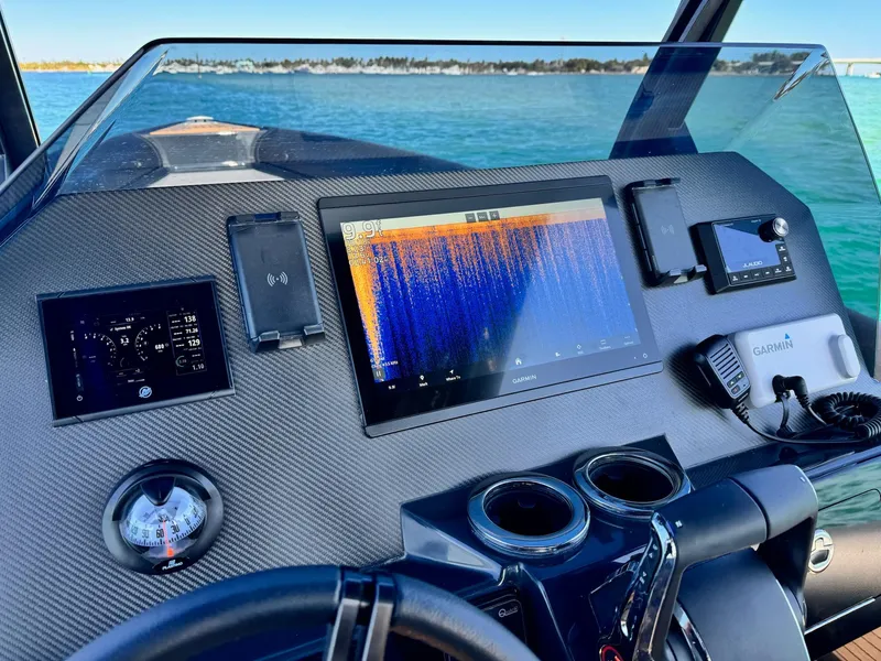 Slide: The Image of Dashboard of 2025 Skipper-BSK 34 boat with advanced navigation and control systems. - 23