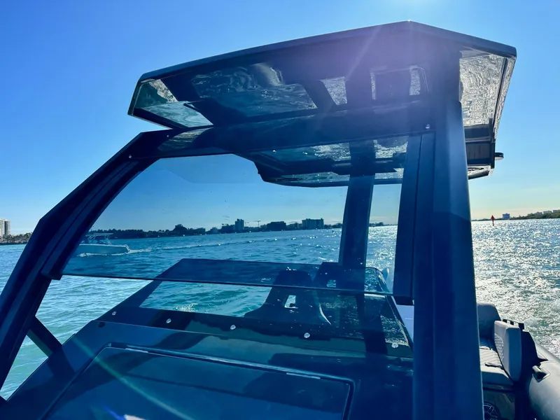 Slide: The Image of 2025 Skipper-BSK 34 boat on water, sunny day, modern design, clear blue sky. - 27