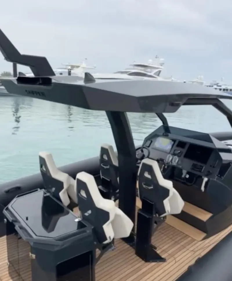 Slide: The Image of 2024 Skipper-BSK 38 boat with modern cockpit and seating, docked in a marina. - 4