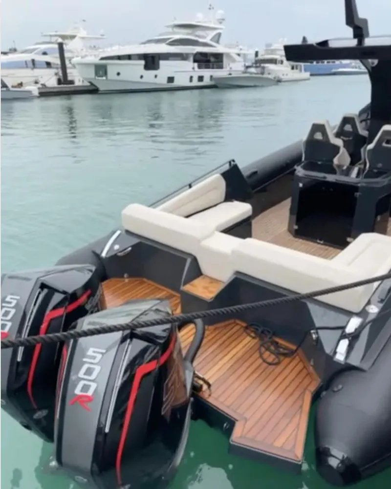 Slide: The Image of 2024 Skipper-BSK 38 boat with dual 500R engines docked in a marina. - 5