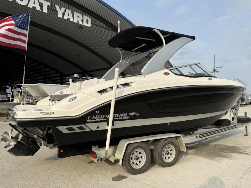 Slide: The Image of 2015 Chaparral 257 SSX boat on trailer at boat yard with American flag. - 12