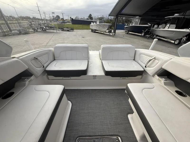 Slide: The Image of Interior of 2015 Chaparral 257 SSX boat with white seating and gray flooring. - 17