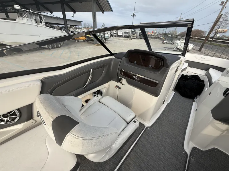 Slide: The Image of 2015 Chaparral 257 SSX boat interior with sleek seating and modern dashboard design. - 2