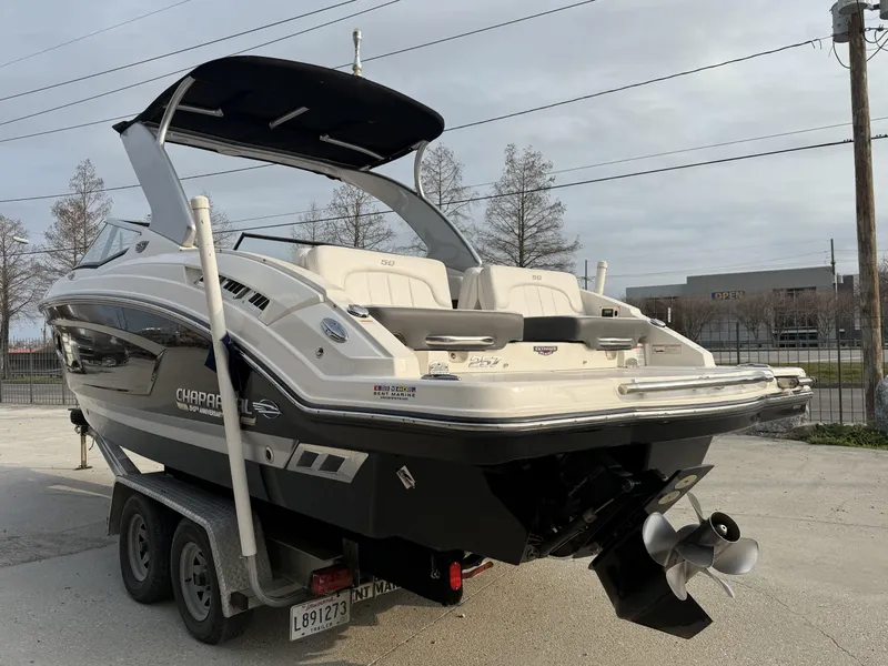 Slide: The Image of 2015 Chaparral 257 SSX boat on trailer, rear view, outdoor setting. - 3