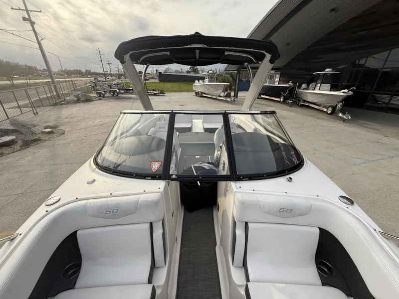 Slide: The Image of 2015 Chaparral 257 SSX boat with sleek design and spacious seating. - 5