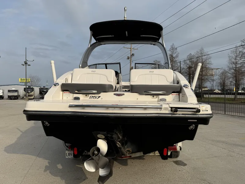 Slide: The Image of 2015 Chaparral 257 SSX boat rear view in a parking lot. - 6