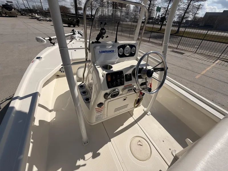 Slide: The Image of 2021 Mako 18 LTS boat interior with steering console and navigation equipment. - 4