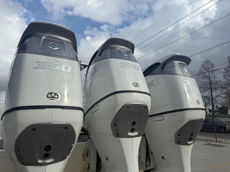 Slide: The Image of Three Suzuki 350 outboard motors on a 2006 SeaHunter 41 CC Offshore boat. - 10
