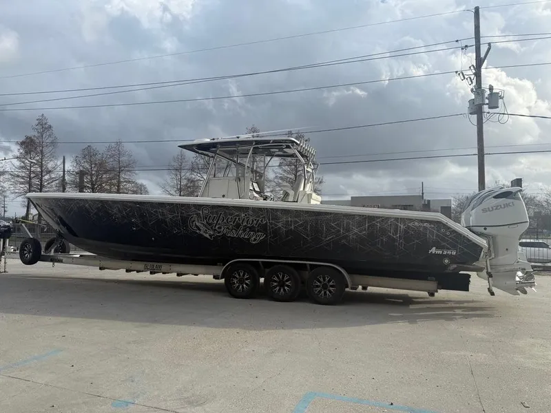 Slide: The Image of 2006 SeaHunter 41 CC Offshore Center Console boat on trailer, parked outdoors. - 11