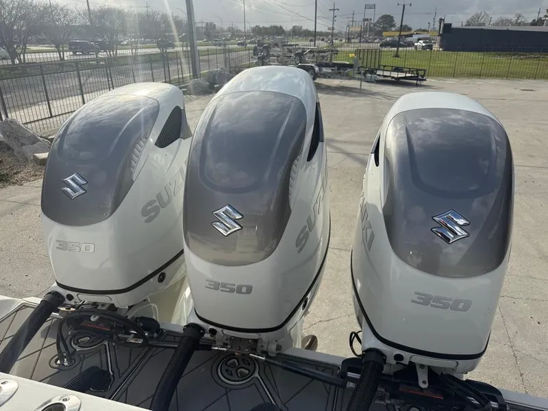 Slide: The Image of Three Suzuki outboard motors on a 2006 SeaHunter 41 CC Offshore Center Console boat. - 14