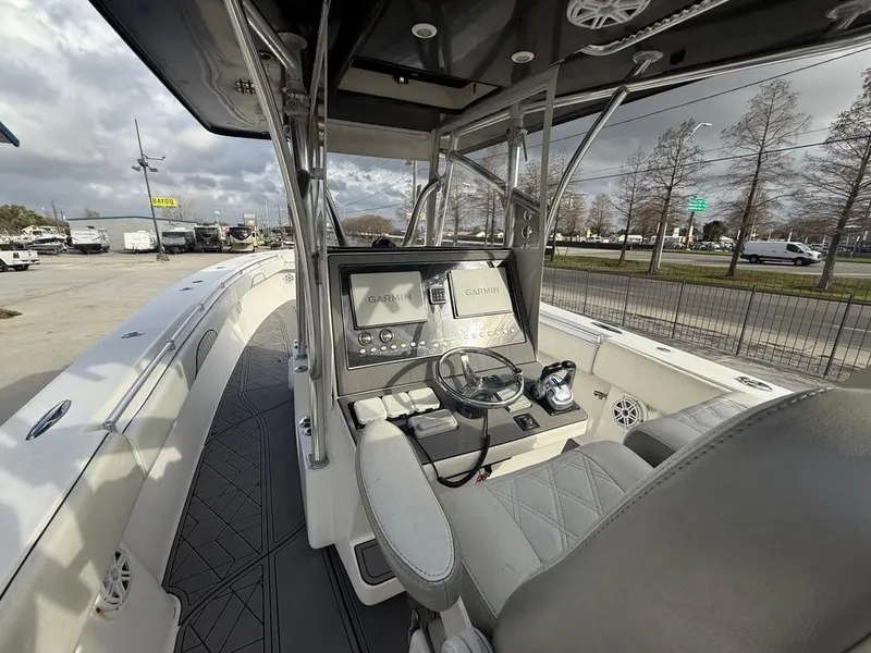 Slide: The Image of 2006 SeaHunter 41 CC Offshore Center Console with modern navigation equipment and spacious seating. - 17