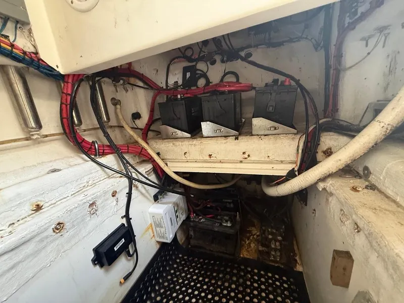 Slide: The Image of Battery compartment of 2006 SeaHunter 41 CC Offshore Center Console boat, showing wiring and components. - 22