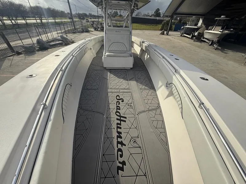 Slide: The Image of 2006 SeaHunter 41 CC Offshore Center Console boat, featuring spacious deck and sleek design. - 25