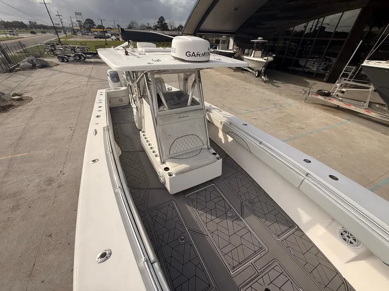Slide: The Image of 2006 SeaHunter 41 CC Offshore Center Console boat with Garmin equipment, docked outdoors. - 28