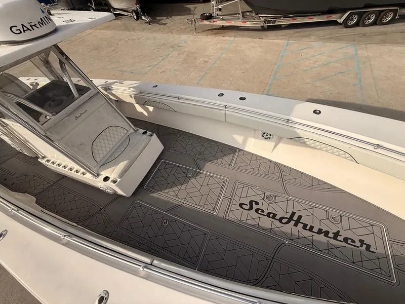 Slide: The Image of 2006 SeaHunter 41 CC Offshore Center Console boat with Garmin equipment and custom deck design. - 29
