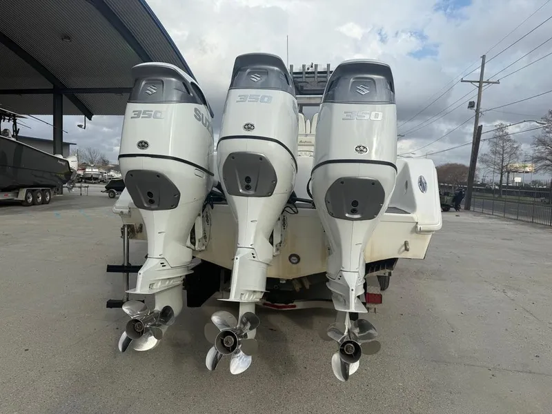 Slide: The Image of Three Suzuki 350 outboard motors on a 2006 SeaHunter 41 CC Offshore boat. - 4