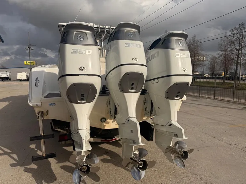Slide: The Image of Triple Suzuki 350 outboard engines on a 2006 SeaHunter 41 CC Offshore boat. - 5