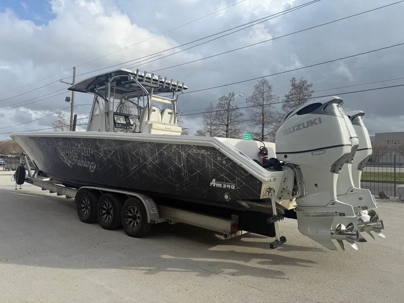 Slide: The Image of 2006 SeaHunter 41 CC Offshore Center Console boat with Suzuki outboard engines on a trailer. - 7