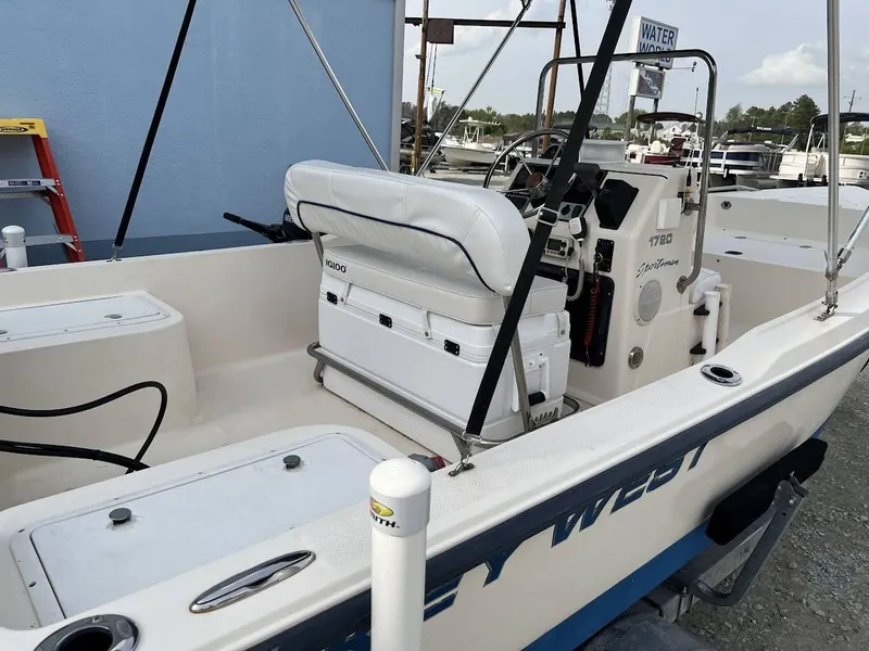 Slide: The Image of 2003 Key West 1720 CC boat interior with seating and console. - 10