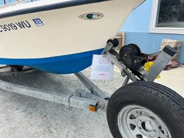 Slide: The Image of 2003 Key West 1720 CC boat on trailer, for sale sign visible. - 8