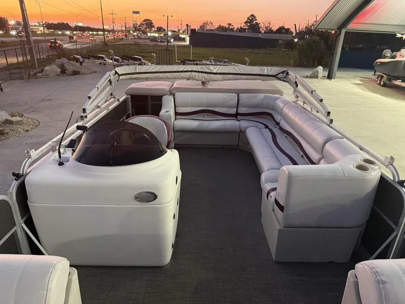 Slide: The Image of 2008 South Bay 25 pontoon boat with spacious seating at sunset. - 13