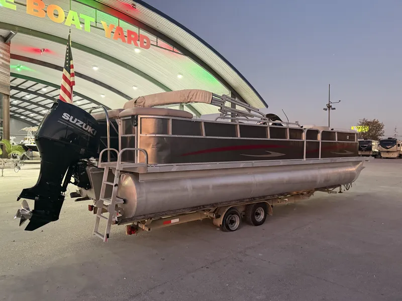 Slide: The Image of 2008 South Bay 25 pontoon boat with Suzuki motor at a boat yard. - 4