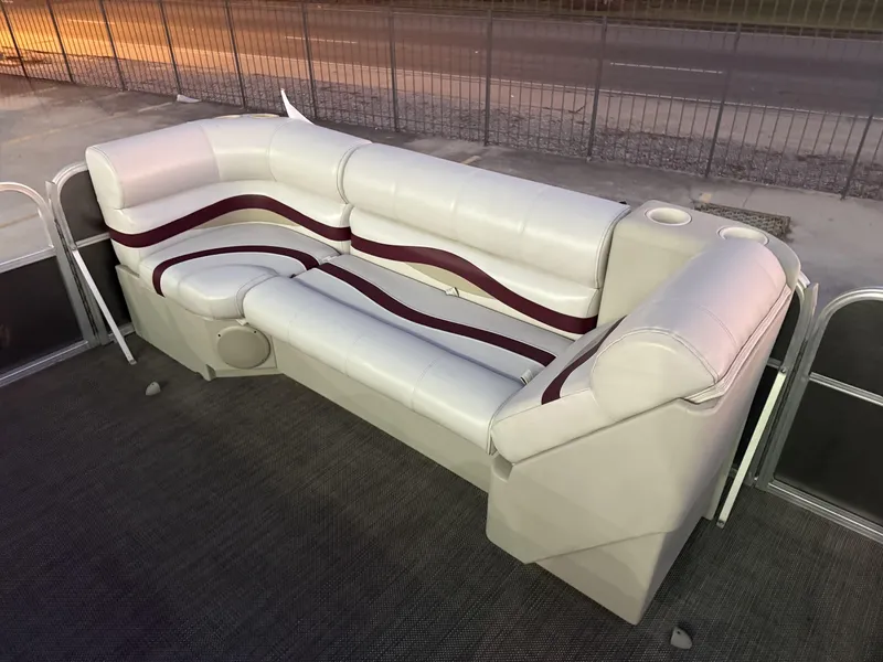 Slide: The Image of Luxurious white and maroon seating on a 2008 South Bay 25 pontoon boat. - 5