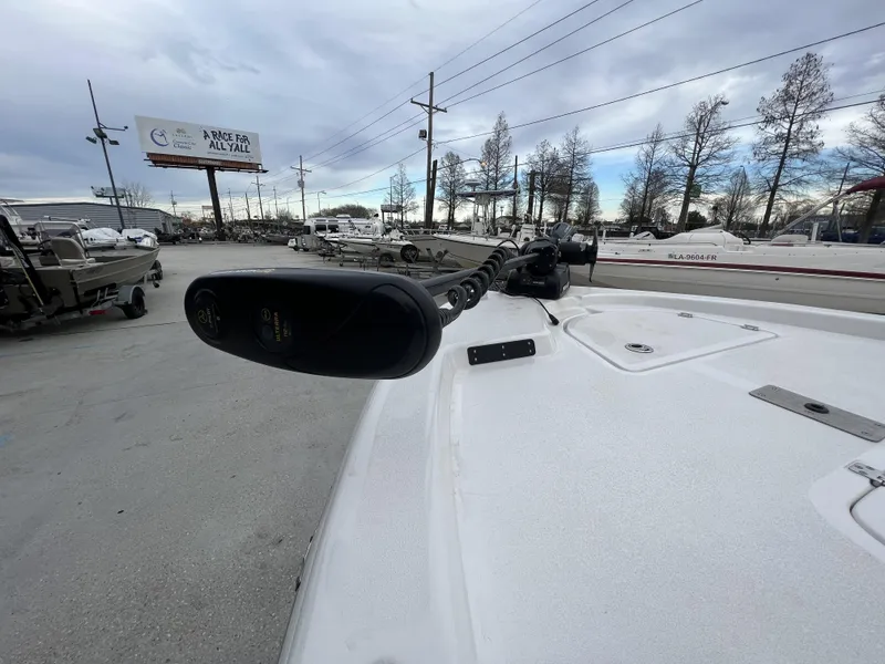 Slide: The Image of 2020 Sea Fox 240 Viper boat with trolling motor in a marina setting. - 13