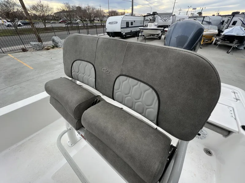 Slide: The Image of 2020 Sea Fox 240 Viper boat seating with gray upholstery in a marina setting. - 5