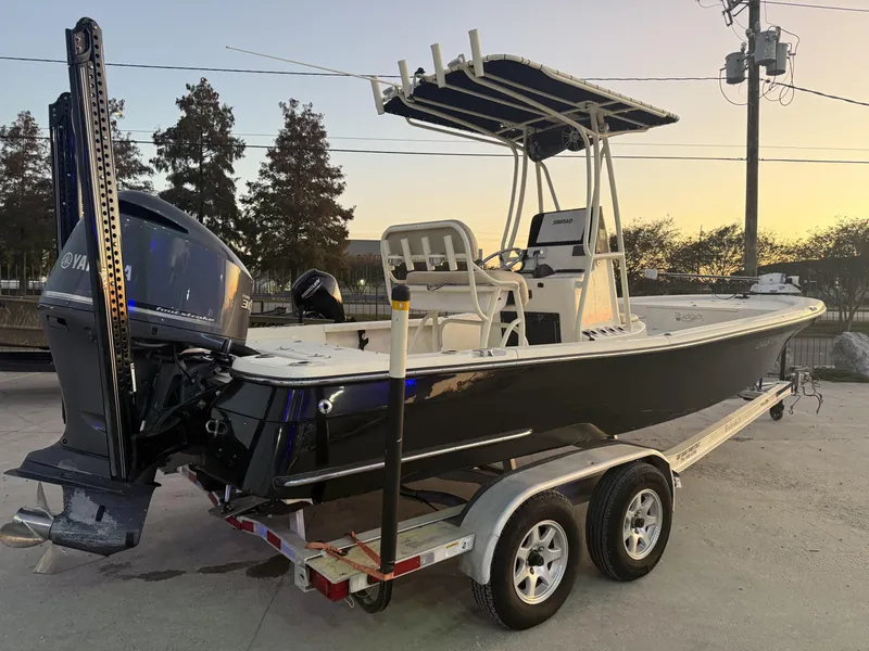 Slide: The Image of 2013 BlackJack 224 boat on trailer with Yamaha engine at sunset. - 16
