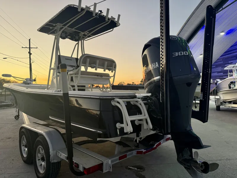 Slide: The Image of 2013 BlackJack 224 boat with Yamaha 300 engine on trailer at sunset. - 3