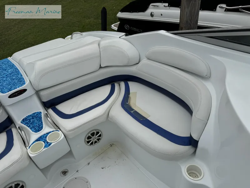 Slide: The Image of 2002 Baja 292 Islander boat interior with white and blue seating. - 24