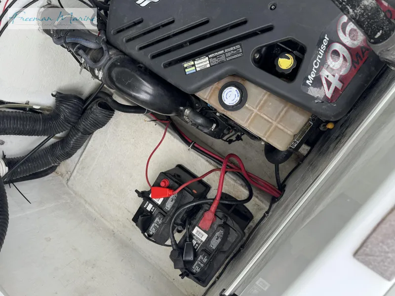 Slide: The Image of Engine compartment of 2002 Baja 292 Islander with MerCruiser 496 engine and batteries. - 28