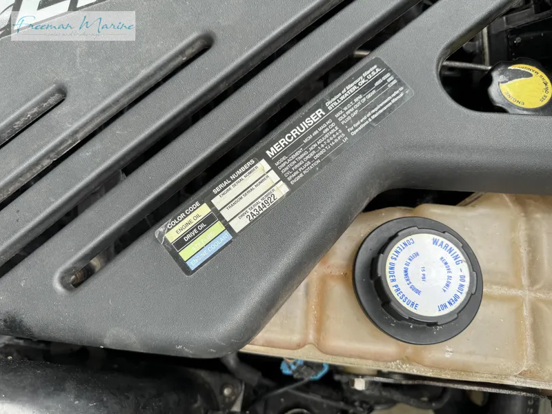 Slide: The Image of Close-up of a 2002 Baja 292 Islander engine with MerCruiser label. - 29