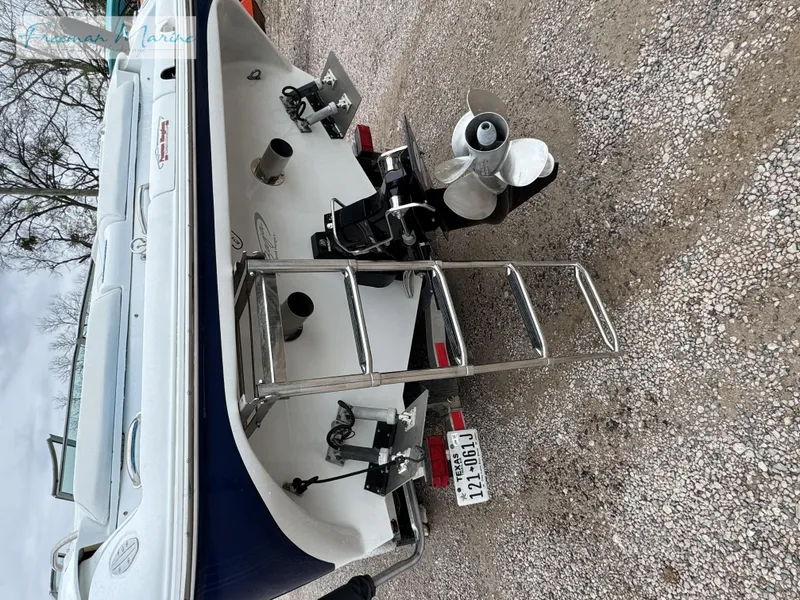 Slide: The Image of 2002 Baja 292 Islander boat rear view with ladder and propeller. - 3