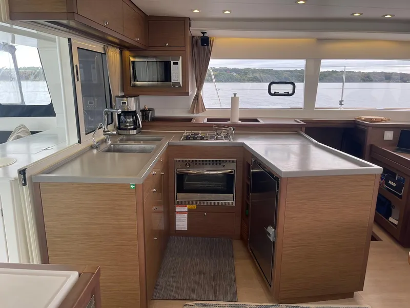 Slide: The Image of Modern kitchen interior of 2019 Lagoon 450 F yacht with appliances and scenic window view. - 10