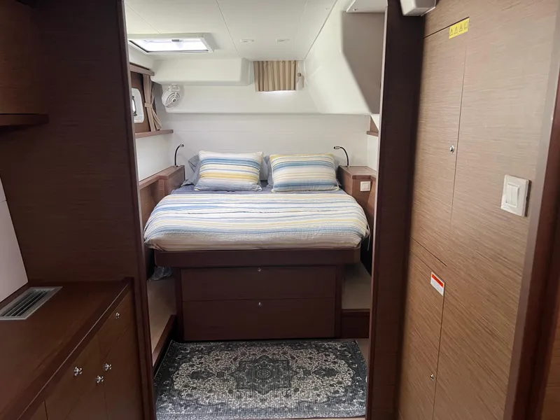 Slide: The Image of Luxurious cabin interior of 2019 Lagoon 450 F catamaran with cozy bed and modern design. - 12