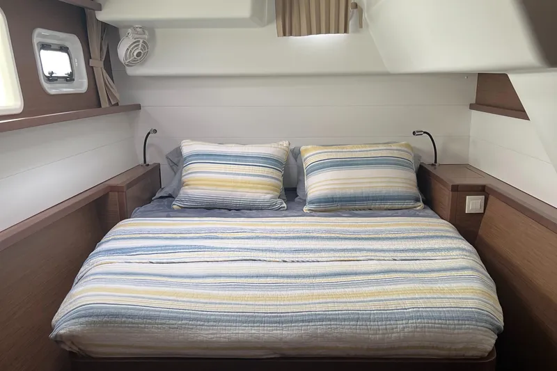 Slide: The Image of Cozy bedroom in 2019 Lagoon 450 F yacht with striped bedding and modern design. - 13
