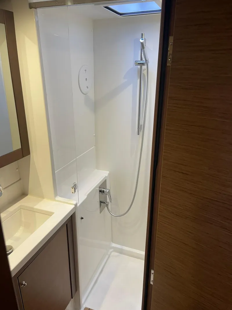 Slide: The Image of 2019 Lagoon 450 F yacht bathroom with modern shower and sink. - 20