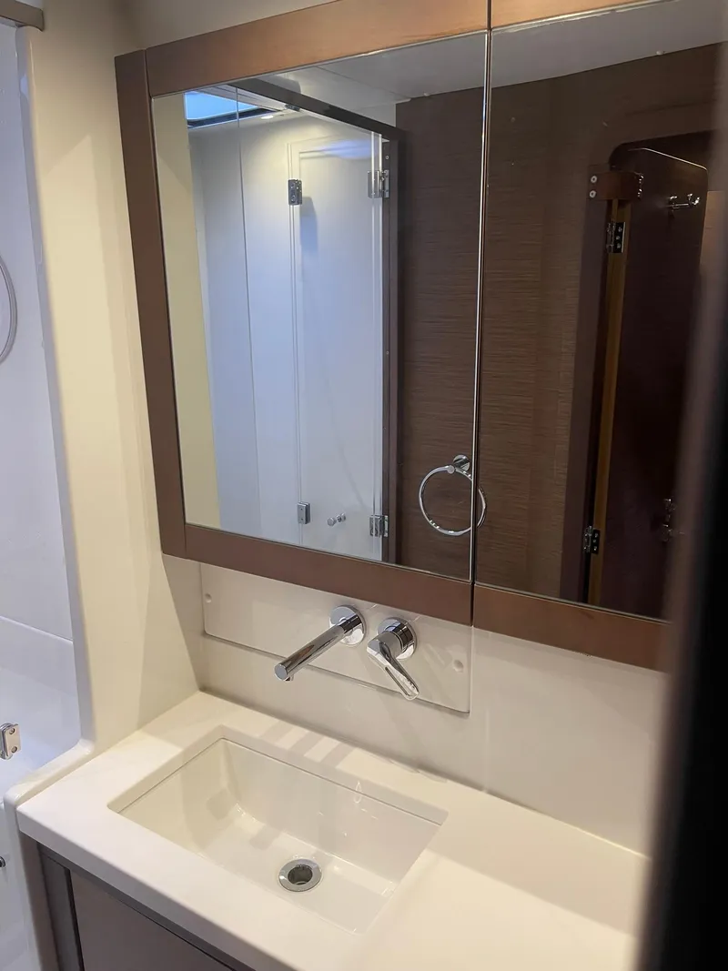 Slide: The Image of Modern bathroom in 2019 Lagoon 450 F yacht with sleek sink and mirror. - 24