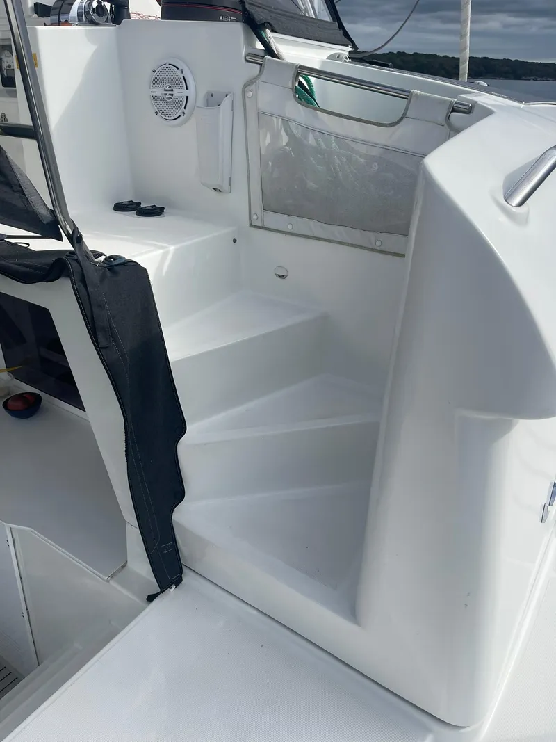 Slide: The Image of Staircase on 2019 Lagoon 450 F catamaran, featuring sleek white design and modern fixtures. - 34