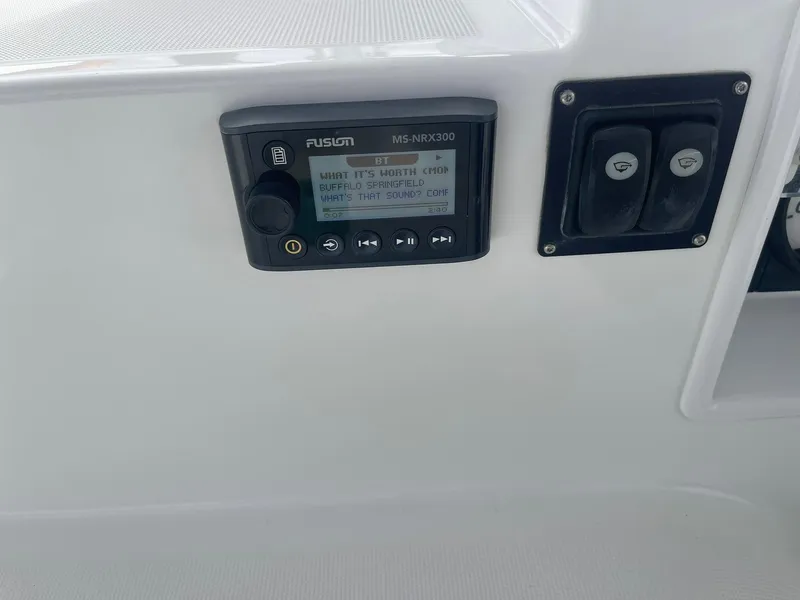 Slide: The Image of Control panel on a 2019 Lagoon 450 F yacht, featuring a Fusion MS-RAK300 stereo system. - 36