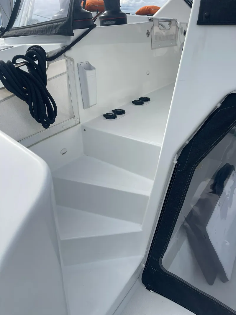 Slide: The Image of Steps on a 2019 Lagoon 450 F catamaran, featuring sleek white design and modern fixtures. - 38